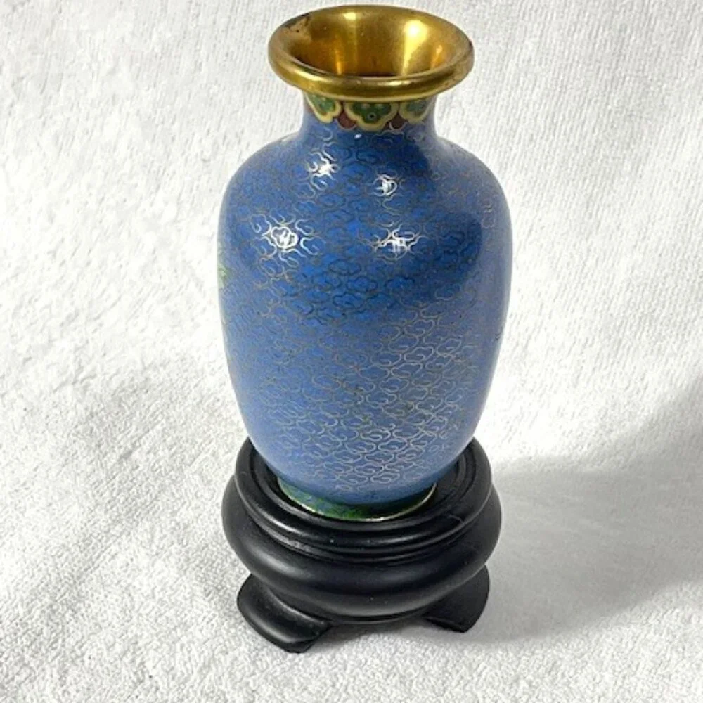 Chinese blue cloisonne and brass vase with wooden stand.